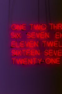 Neon sign listing numbers not in order